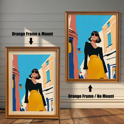 A split image showing two different framing options for the same artwork. On the left, a framed print with an orange wood-tone frame and a white mat (mount) is labeled "Orange Frame & Mount." On the right, the same print is shown in an orange wood-tone frame without a mat, labeled "Orange Frame / No Mount." Both images are against a rustic wood-paneled wall. The art depicts a stylish woman in a black shirt and yellow skirt standing on a street.