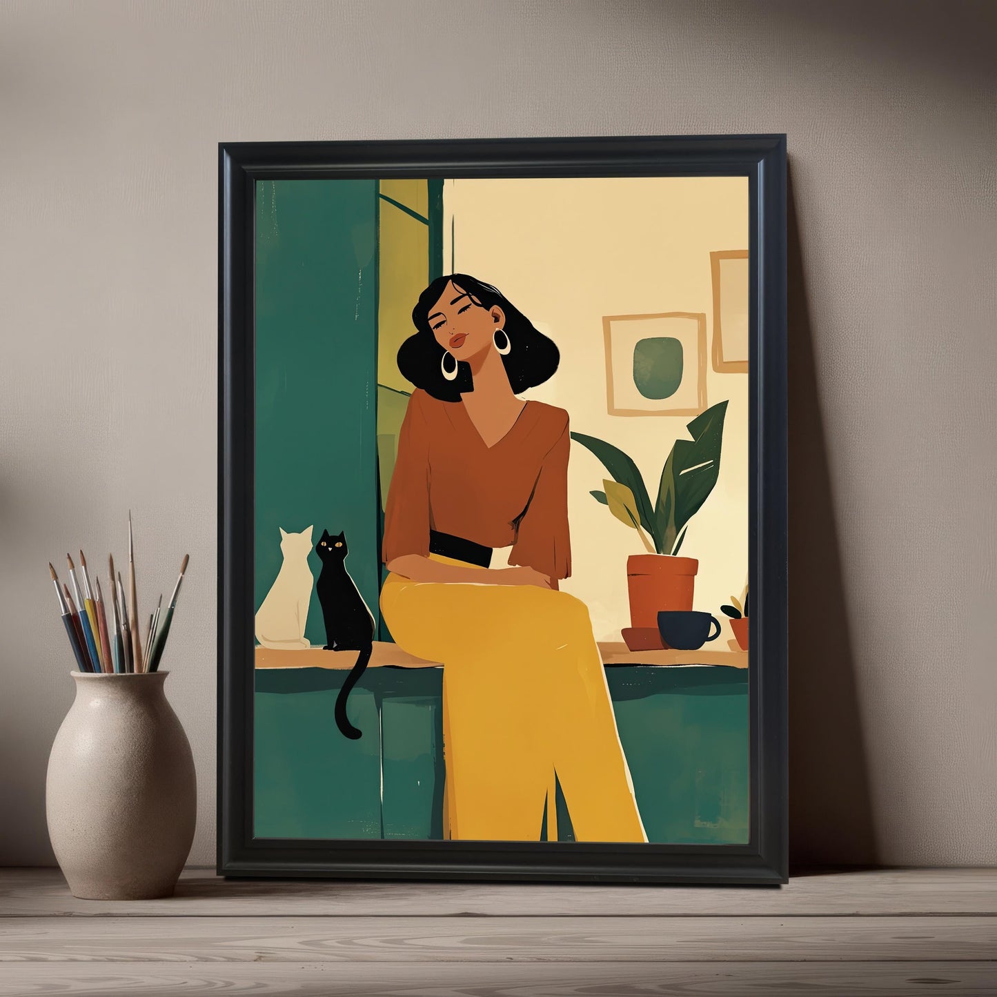 Single black framed wall art print of a woman and a cat, styled on a rustic wooden surface with a vase of paintbrushes. A perfect gift for cat lovers and art enthusiasts.