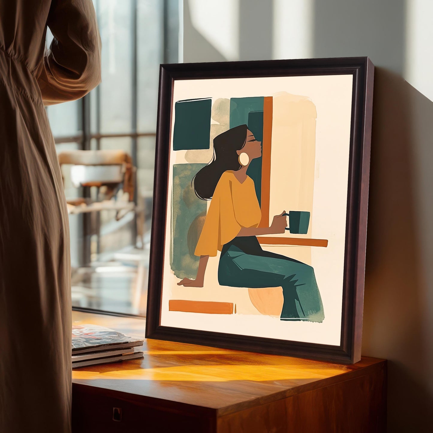 Coffee wood framed wall art print of a woman with a coffee cup, placed on a wooden dresser. A person stands nearby, providing a sense of scale. Ideal for a cozy bedroom or study.