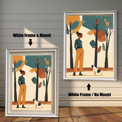 Two framed art prints of a woman and a dog in a park. The left print has a white frame and a white mat ("mount"), while the right print has a white frame with no mat.