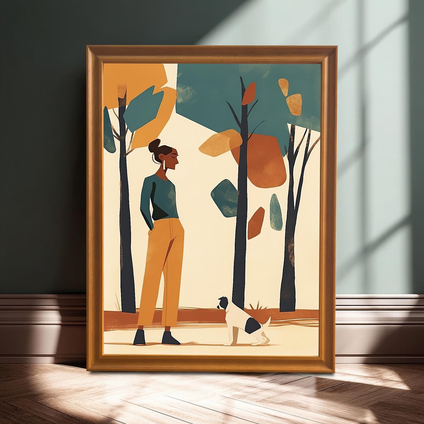 A framed art print of a woman and a dog in a park, propped against a dark teal wall.
