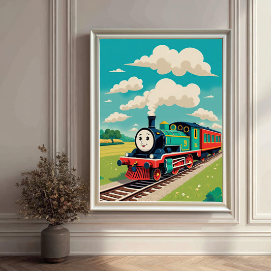 A whimsical, framed wall art print of a smiling cartoon train in a field, with a white frame. The vibrant colors and playful style are visible against a beige, paneled wall and a dark, potted plant.