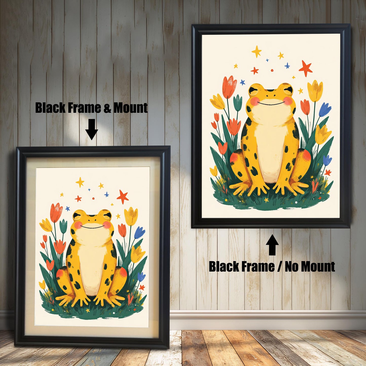 Two versions of a happy yellow frog wall art print with a black wood frame. The print on the left is a smaller size framed with a white mount (or mat), and the one on the right is a larger size without a mount. The image shows the framed print hanging against a white paneled wall.