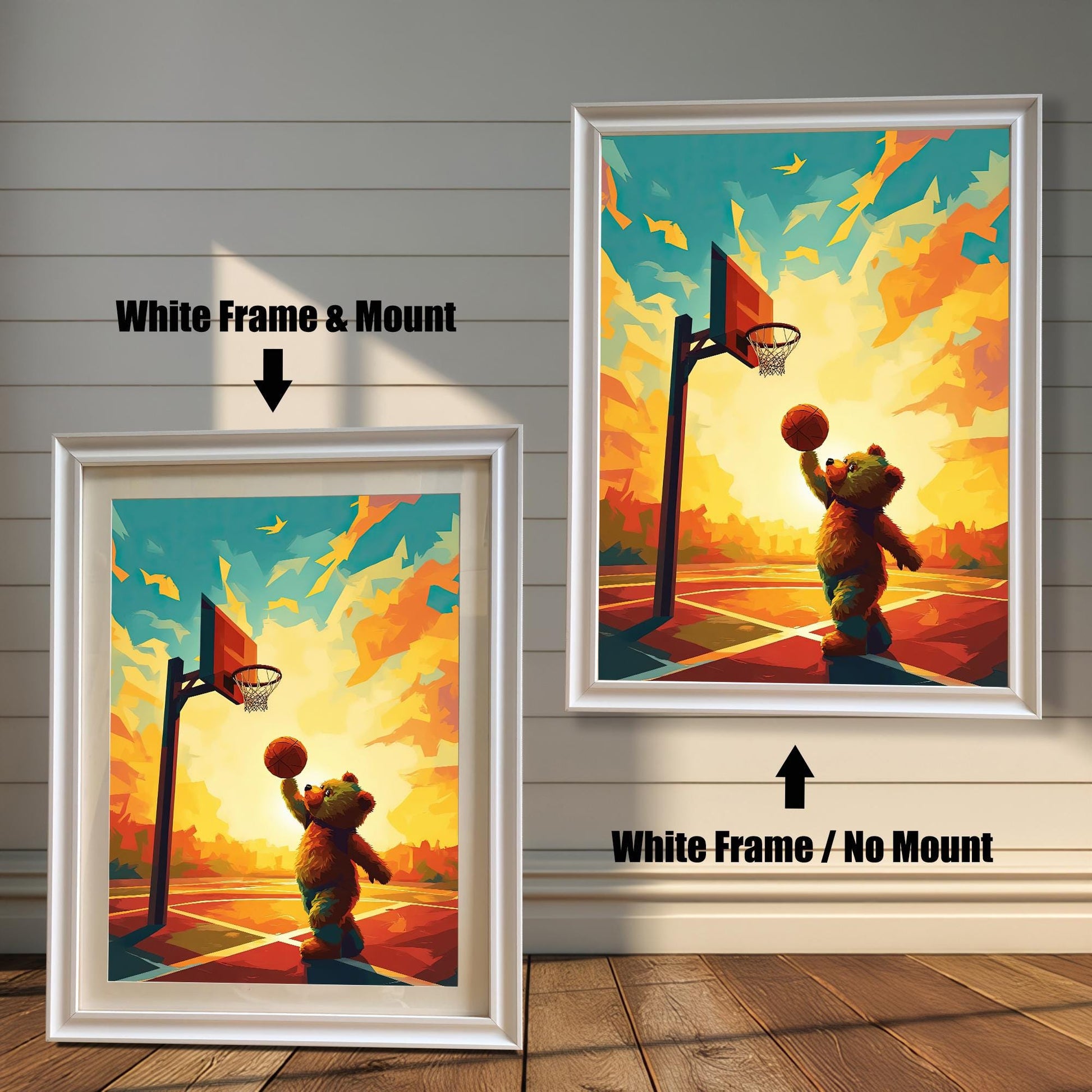 Two versions of a playful teddy bear playing basketball art print with a white wood frame. The print on the left is a smaller size framed with a white mount (or mat), and the one on the right is a larger size without a mount. The image shows the framed prints against a white paneled wall.