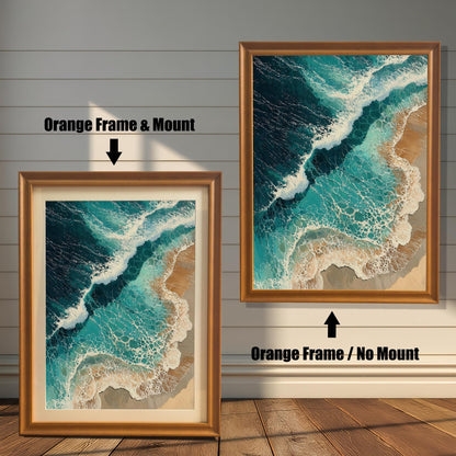 Two framed art prints are shown. The one on the left has an orange-colored frame with a mount, and the one on the right has an orange-colored frame with no mount. The print itself is an aerial view of waves on a beach.