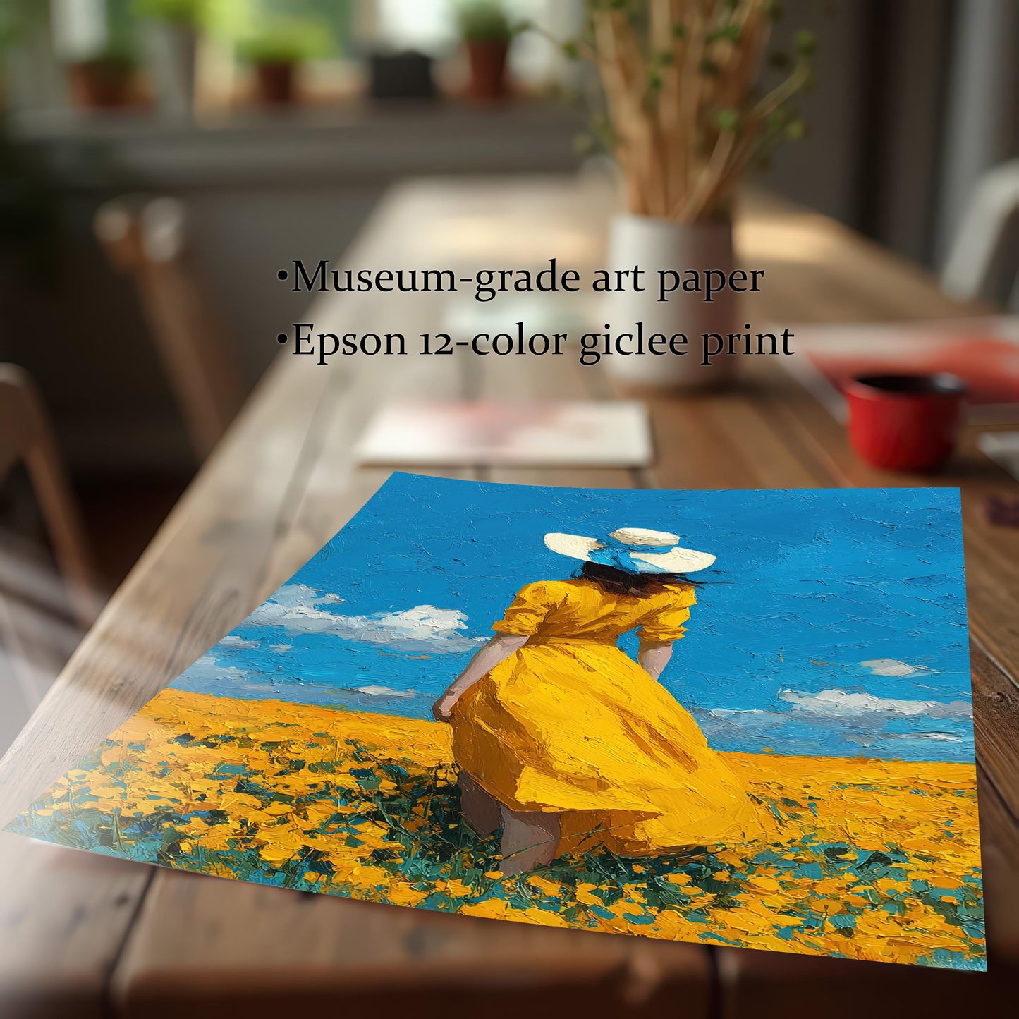 A close-up, angled view of an unframed art print of a woman in a yellow dress in a field. Text notes it is a "museum-grade art paper" and "Epson 12-color giclee print."