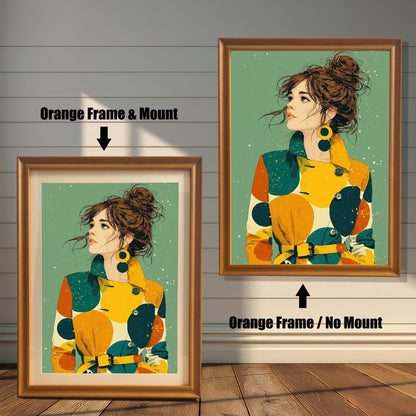 Two framed art prints on a wood floor against a white wall. The left has an orange frame with a mount, and the right has an orange frame without a mount. Both feature a portrait of a woman in a colorful coat.