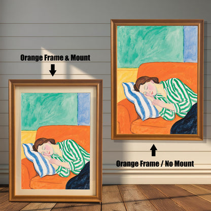 A painting of a woman sleeping on an orange sofa with a blue and white striped pillow. The image shows two framing options: a light brown "orange" frame with a white mat and a light brown frame with no mat.