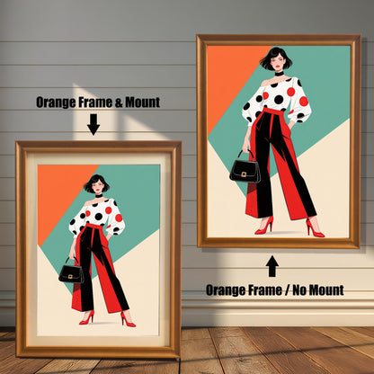 Two framed prints are shown side by side against a paneled wall. One is an "Orange Frame & Mount," and the other is an "Orange Frame / No Mount," showing the effect of a mat.