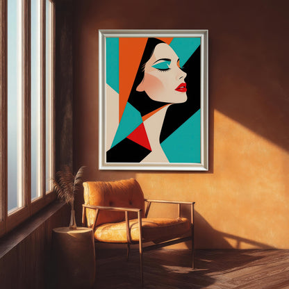 An abstract portrait of a woman in a silver frame hanging on a rust-colored wall. A brown leather armchair sits below the artwork next to a window.