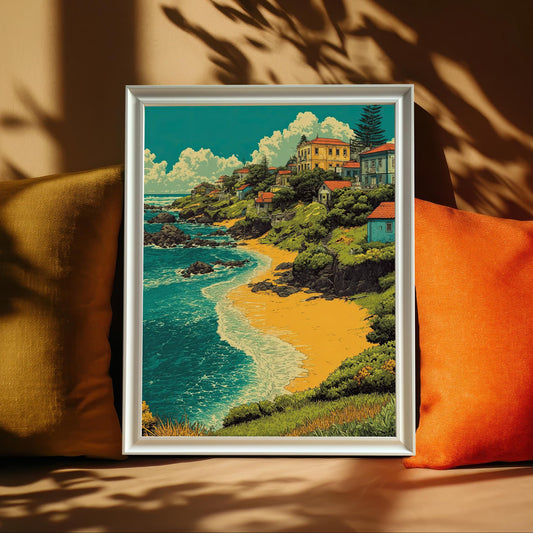 A painting of a village by a beach is leaning against yellow and orange pillows on a brown couch. The artwork is in a white frame.