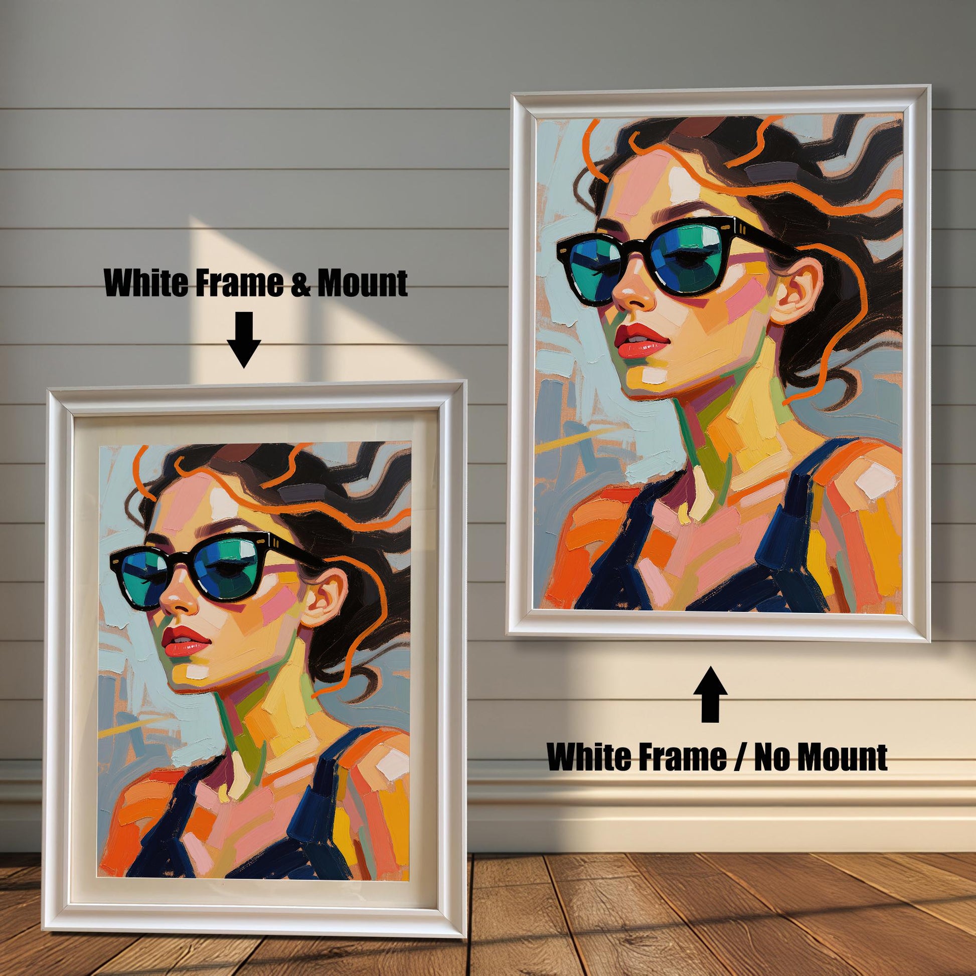 An art print of a woman in sunglasses is shown in two white frames against a rustic wood wall. One has a white mount, the other does not.