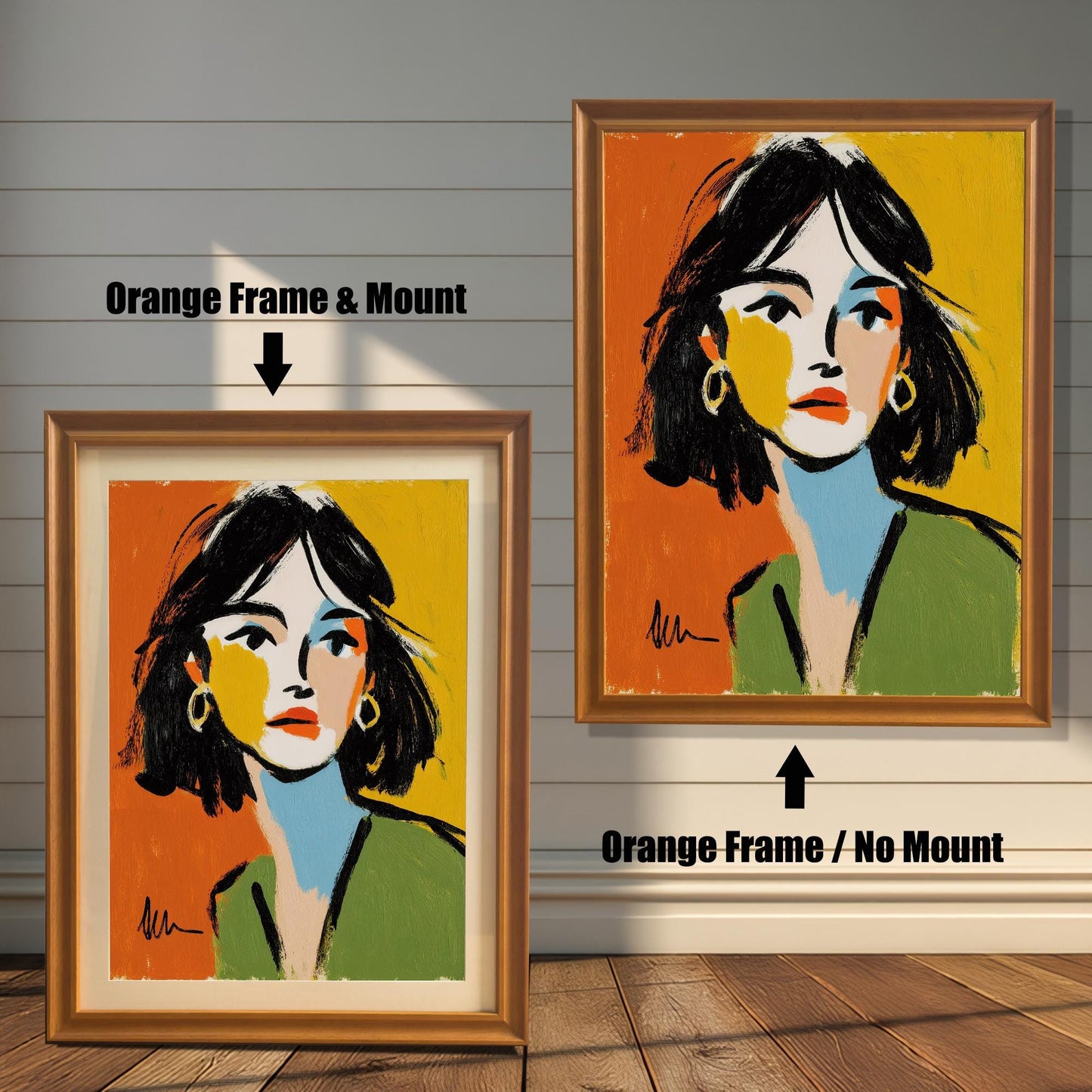 An abstract portrait of a woman is shown in two orange-colored frames against a rustic wood wall. One has a mount, the other does not.