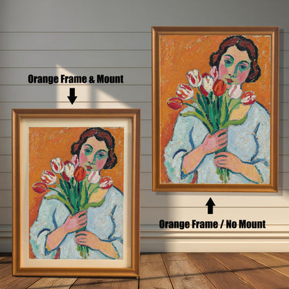 A side-by-side comparison of the same art print with an orange frame. One is framed with a white mount, and the other is framed without.