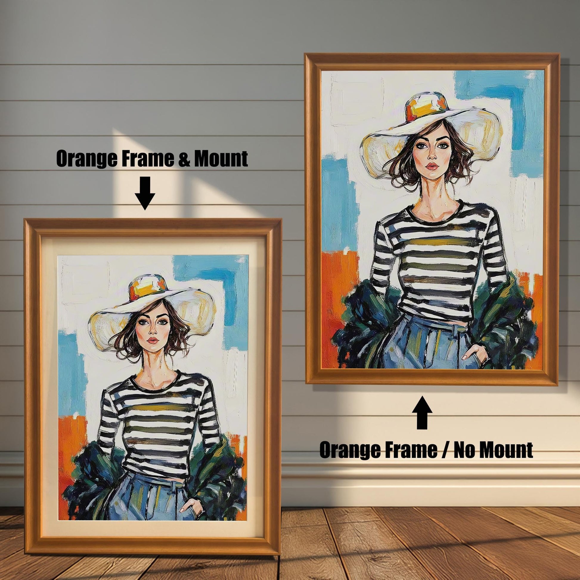 Two framed art prints on a wooden wall showing different orange frame options. One print has an **Orange Frame & Mount**, and the other has an **Orange Frame / No Mount**.
