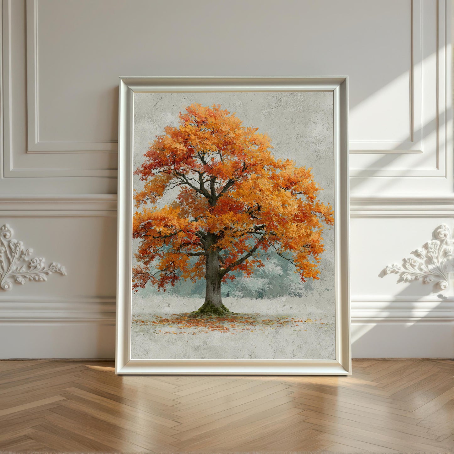 A framed painting of an autumn tree is propped up against a white wall with decorative molding and sunlight shining through a window.
