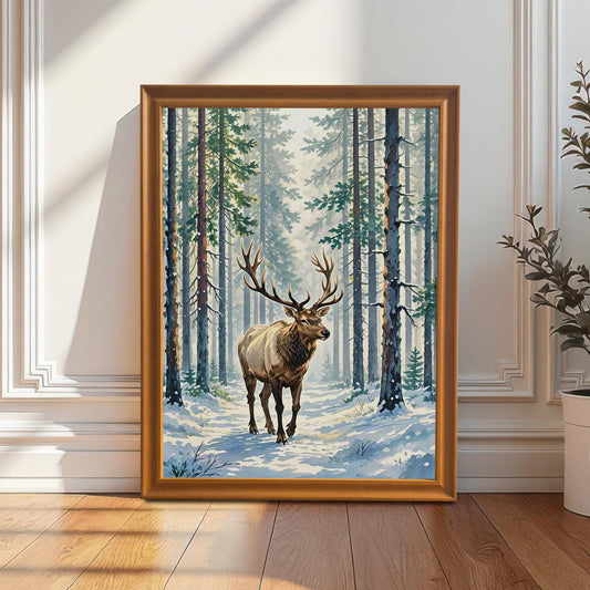 A framed painting of an elk with large antlers in a snowy pine forest. The art, in an orange wood frame, leans on a light wood floor against a white paneled wall with a plant in a white pot.
