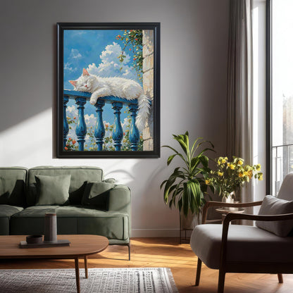 A large black-framed art print of a fluffy white cat sleeping on a blue balcony railing, hanging on a gray wall above a green couch in a living room.