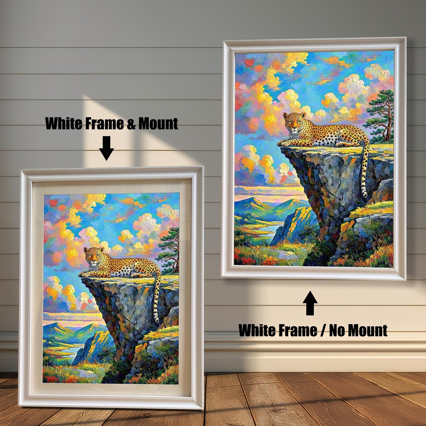 Two framed paintings of a leopard on a cliffside. The one on the left has a white frame with a mount, and the one on the right has a white frame with no mount.