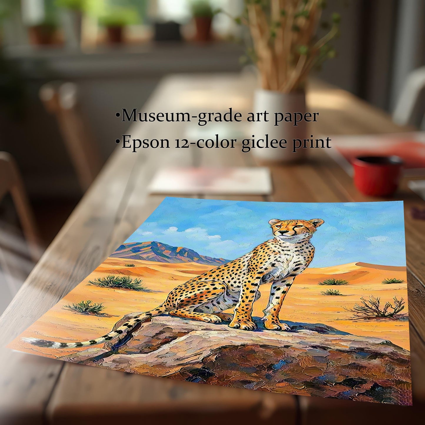A close-up of an unframed print of a cheetah in a desert, resting on a wooden table.