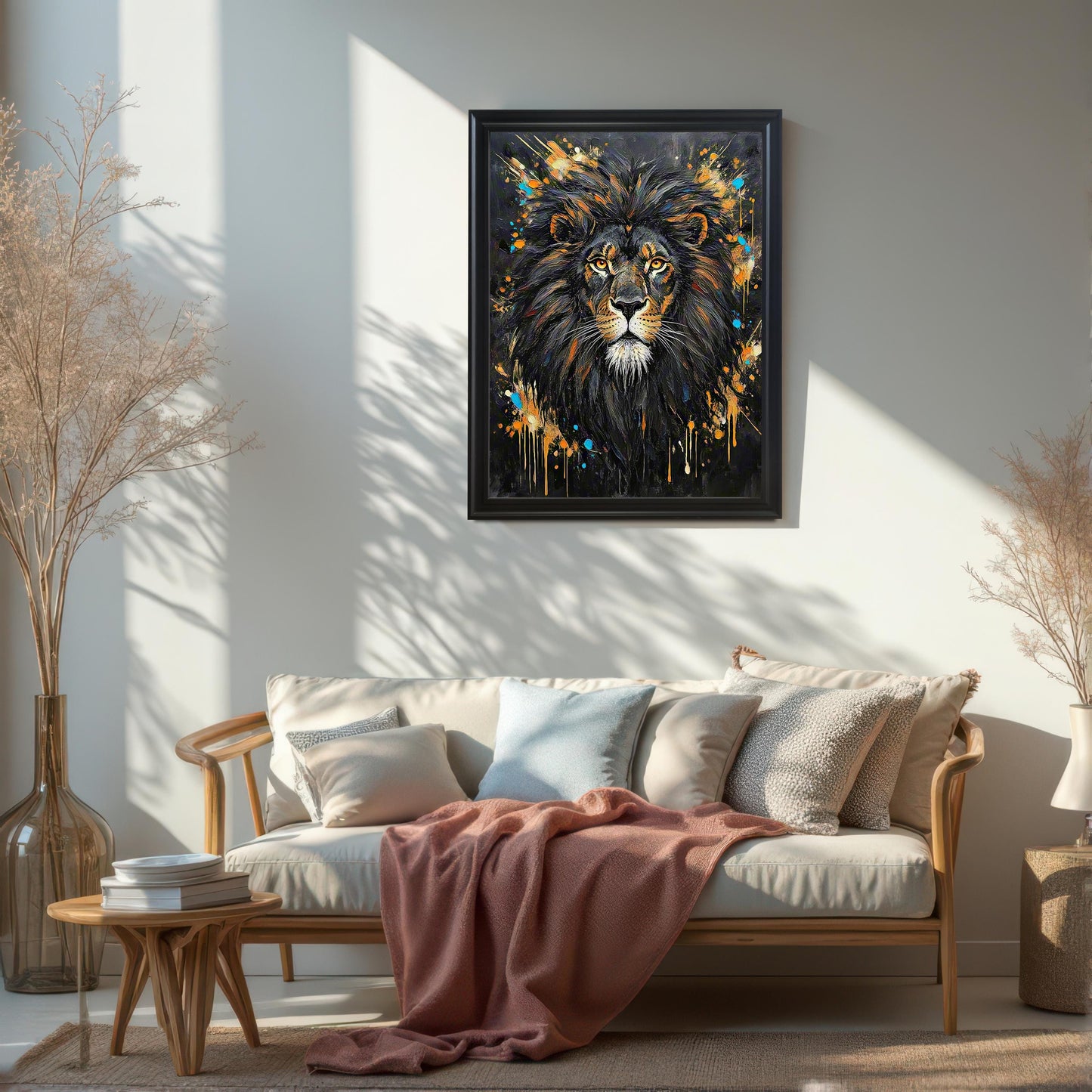 Framed wall art of an abstract lion portrait, hung in a living room above a couch.