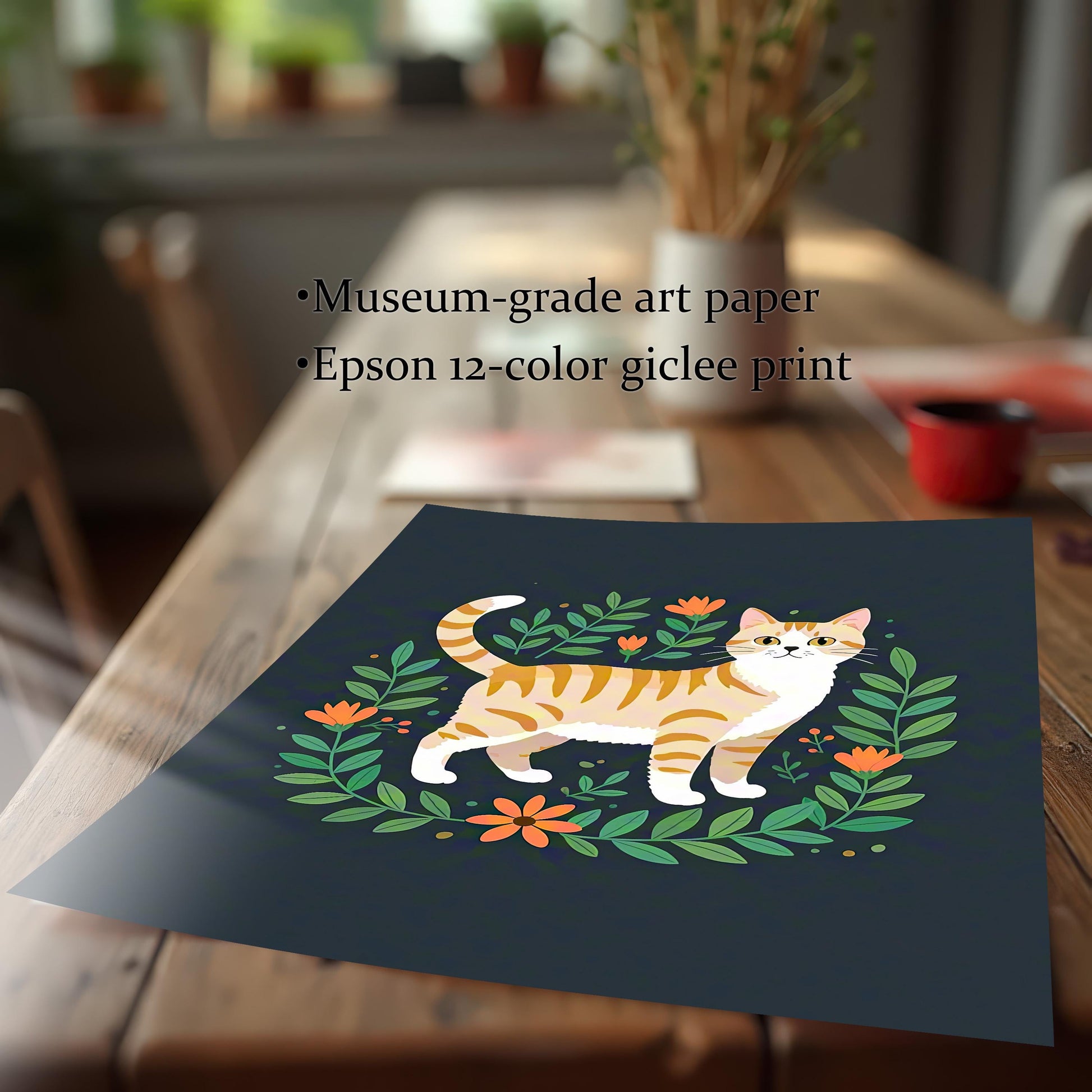 A loose, unframed art print of an orange striped cat surrounded by a floral wreath, laying on a wooden dining table. Text highlights the use of museum-grade art paper and an Epson 12-color giclee print.