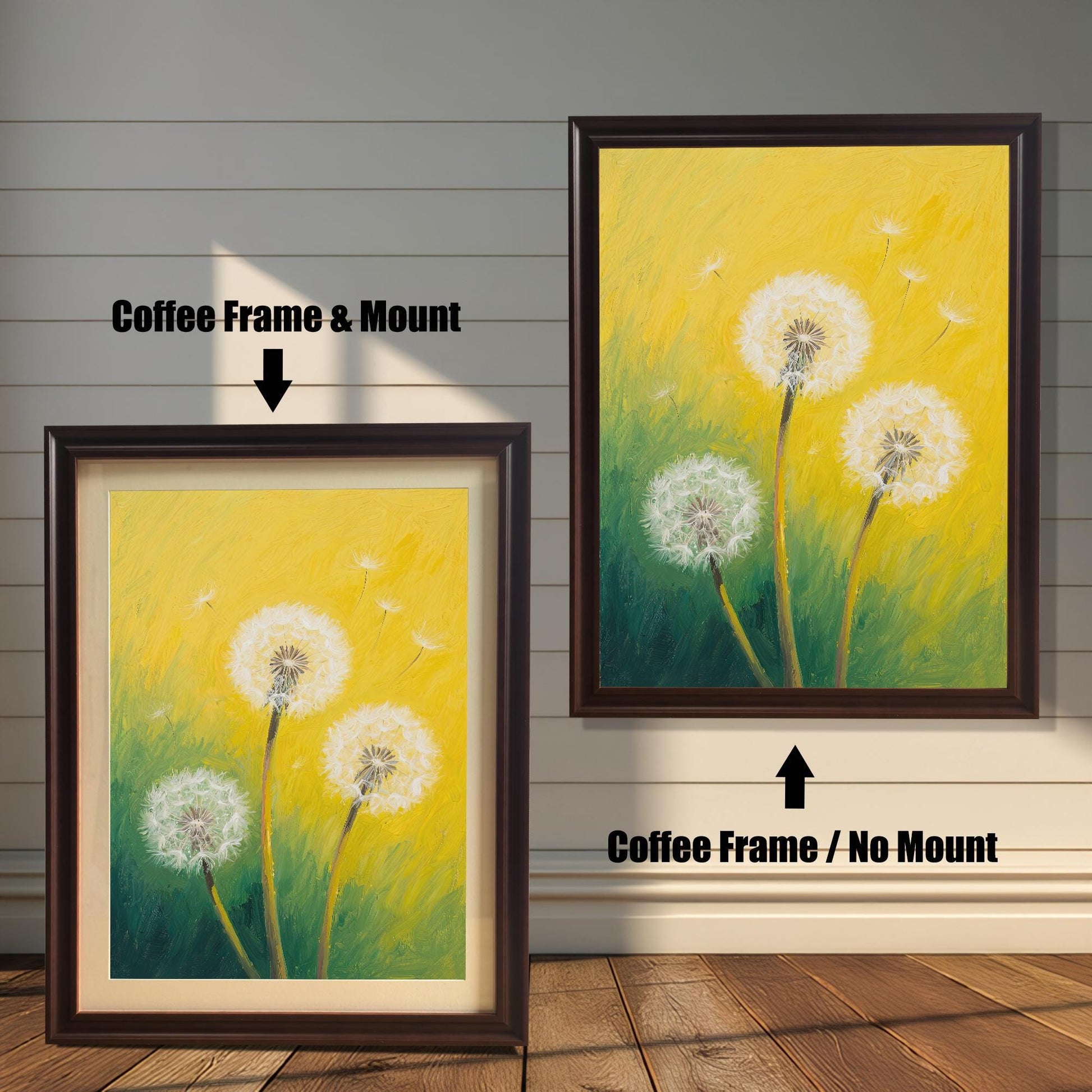 Two framed dandelion art prints on a wood paneled wall. One has a coffee-colored frame with a mount, while the other is the same frame without a mount.