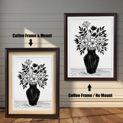 A black and white drawing of flowers in a vase, shown in two coffee-colored frames. The one on the left has a mount, and the one on the right hangs without a mount.