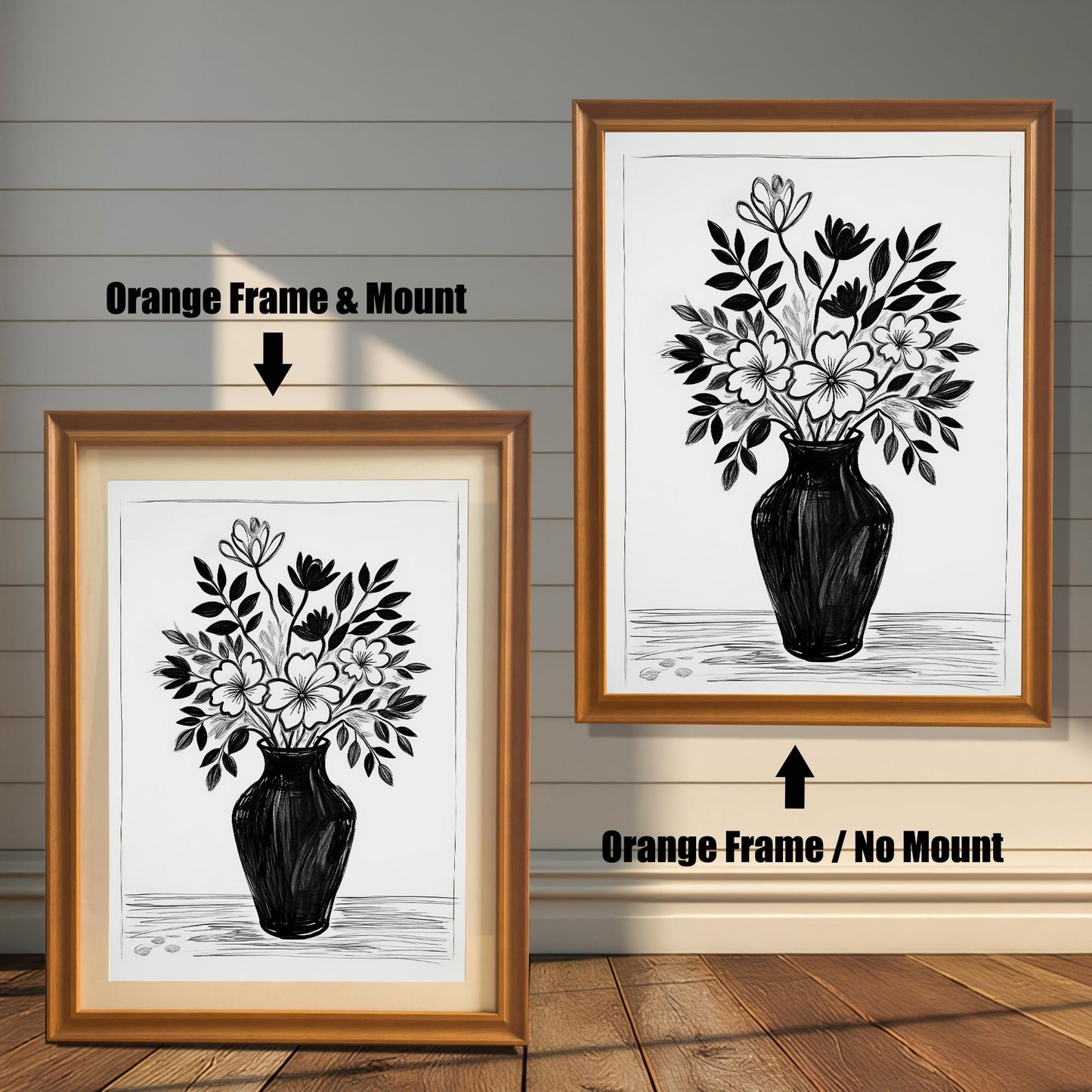 A black and white drawing of flowers, shown in two orange-brown frames. The one on the left includes a light mount, while the one on the right hangs on the wall without a mount.