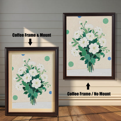 A vibrant painting of white flowers, shown in two coffee-colored frames. The one on the left has a light-colored mount, while the one on the right hangs on the wall without a mount.