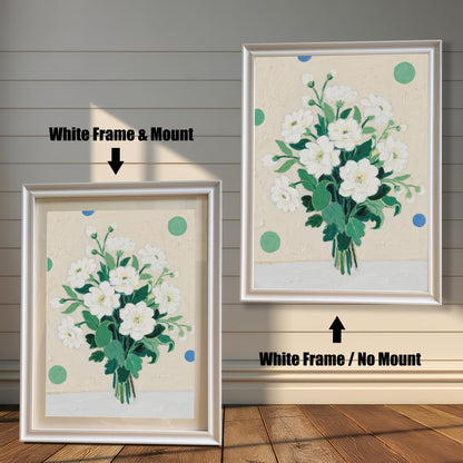 A painting of a bouquet of white flowers, shown in two white frames. The first frame includes a mount, while the second shows the artwork without one.