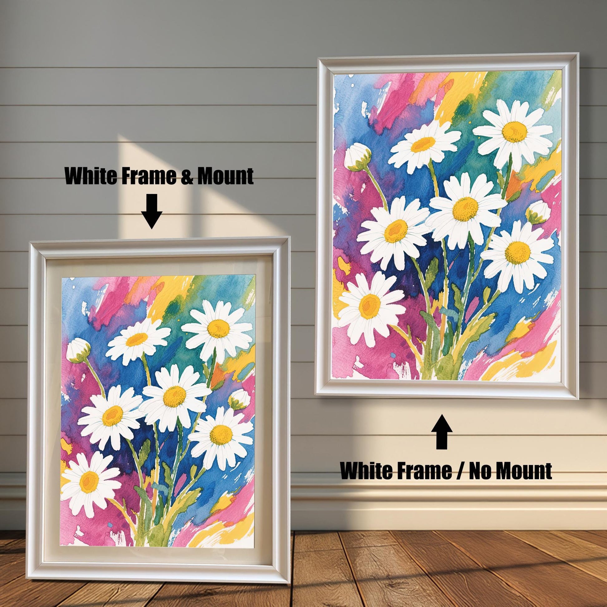 A side-by-side comparison of two framed daisy prints. The one on the left has a white frame and a cream-colored mat. The one on the right has a white frame with no mat.