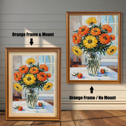 A side-by-side comparison of two framed flower prints. The one on the left has an orange-colored frame and a mat. The one on the right has an orange-colored frame with no mat.