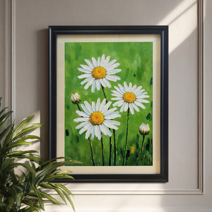 A framed, vertical print of white daisies with yellow centers and green stems. The background is a vibrant green. It hangs on a beige wall next to a houseplant.