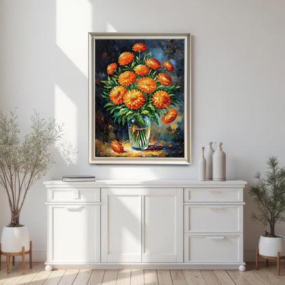 A white-framed art print of orange flowers hangs on a white wall above a white cabinet. Potted plants flank the cabinet.