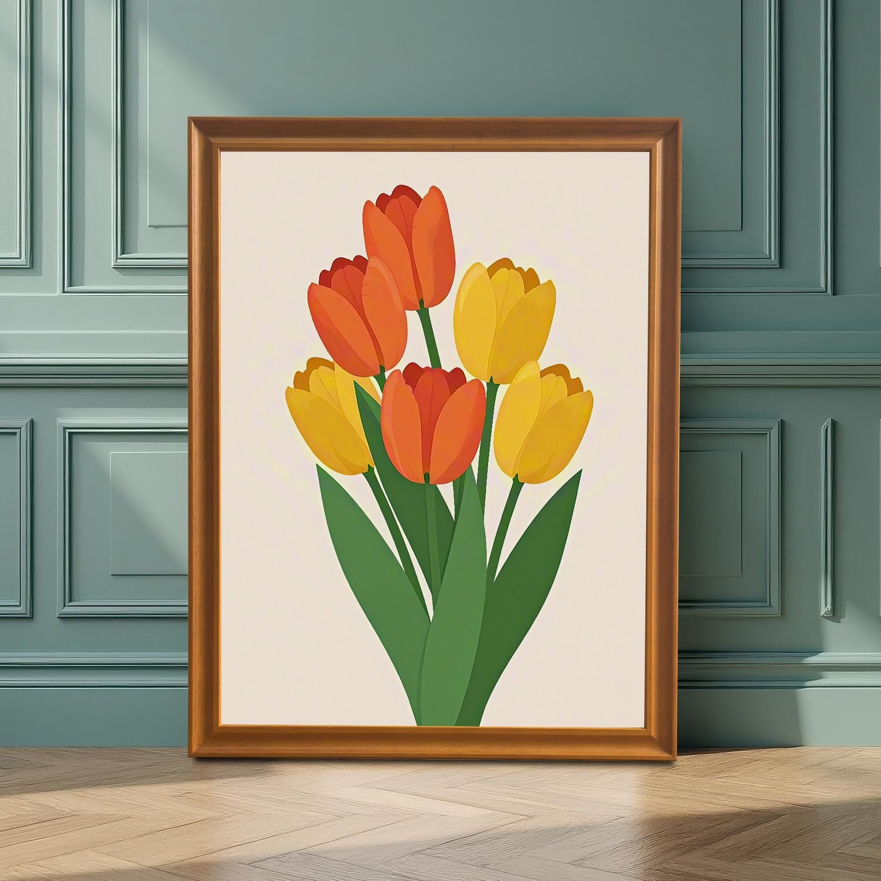 A framed art print of orange and yellow tulips stands on a light wood floor leaning against a teal, paneled wall.