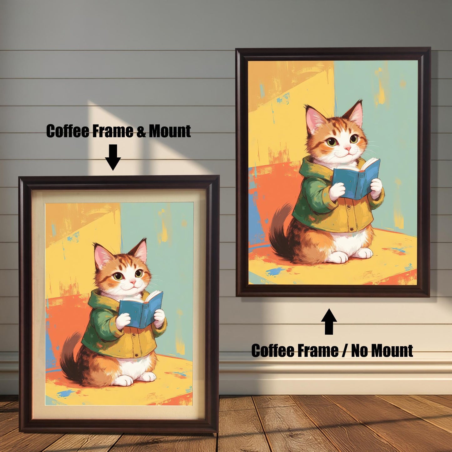 Two coffee-colored dark brown wood-framed art prints, showing a cute cat reading a book. The print on the left has a white mat (mount), and the one on the right is a full-frame display. Both are shown against a white wood paneled wall.