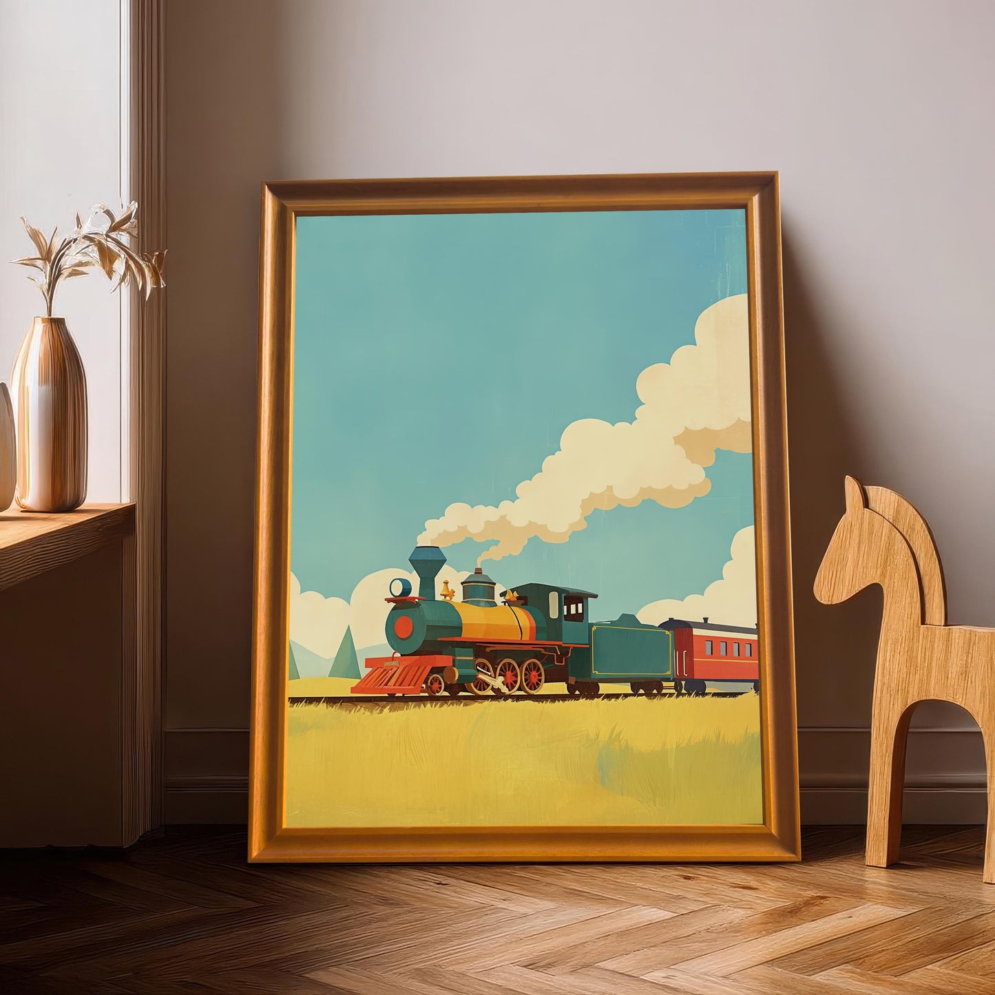 A large, gold wood framed art print of a retro train. The print is leaning against a wall on a wood floor, with a wooden horse toy and a vase nearby.