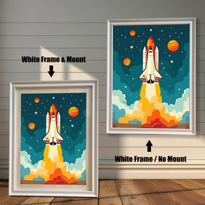 Two framed rocket ship prints. The one on the left has a white frame with a white mount, and the one on the right has a white frame without a mount.