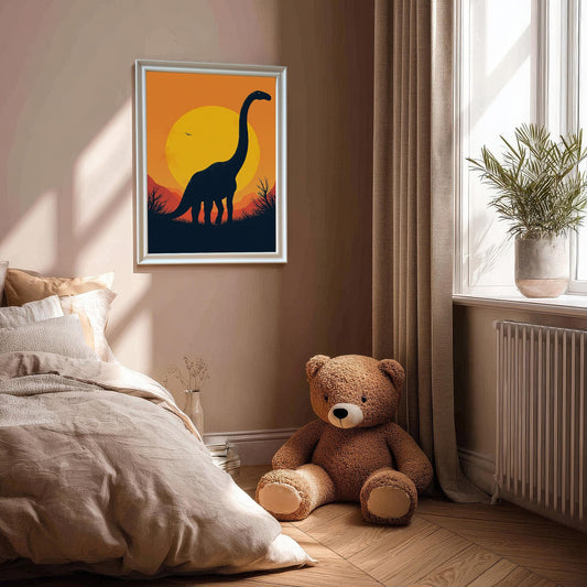 A white-framed print of a dinosaur silhouette hangs on a wall in a bedroom setting with a teddy bear on the floor.