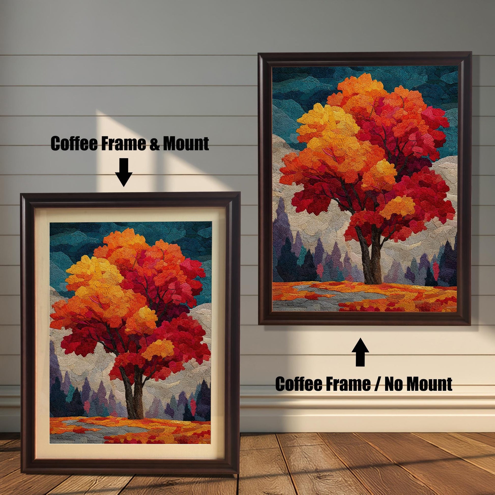 Two framed prints of an autumn tree stand on a wooden floor against a white paneled wall. The one on the left has a coffee-colored frame with a mount (mat), and the one on the right has a coffee-colored frame without a mount.
