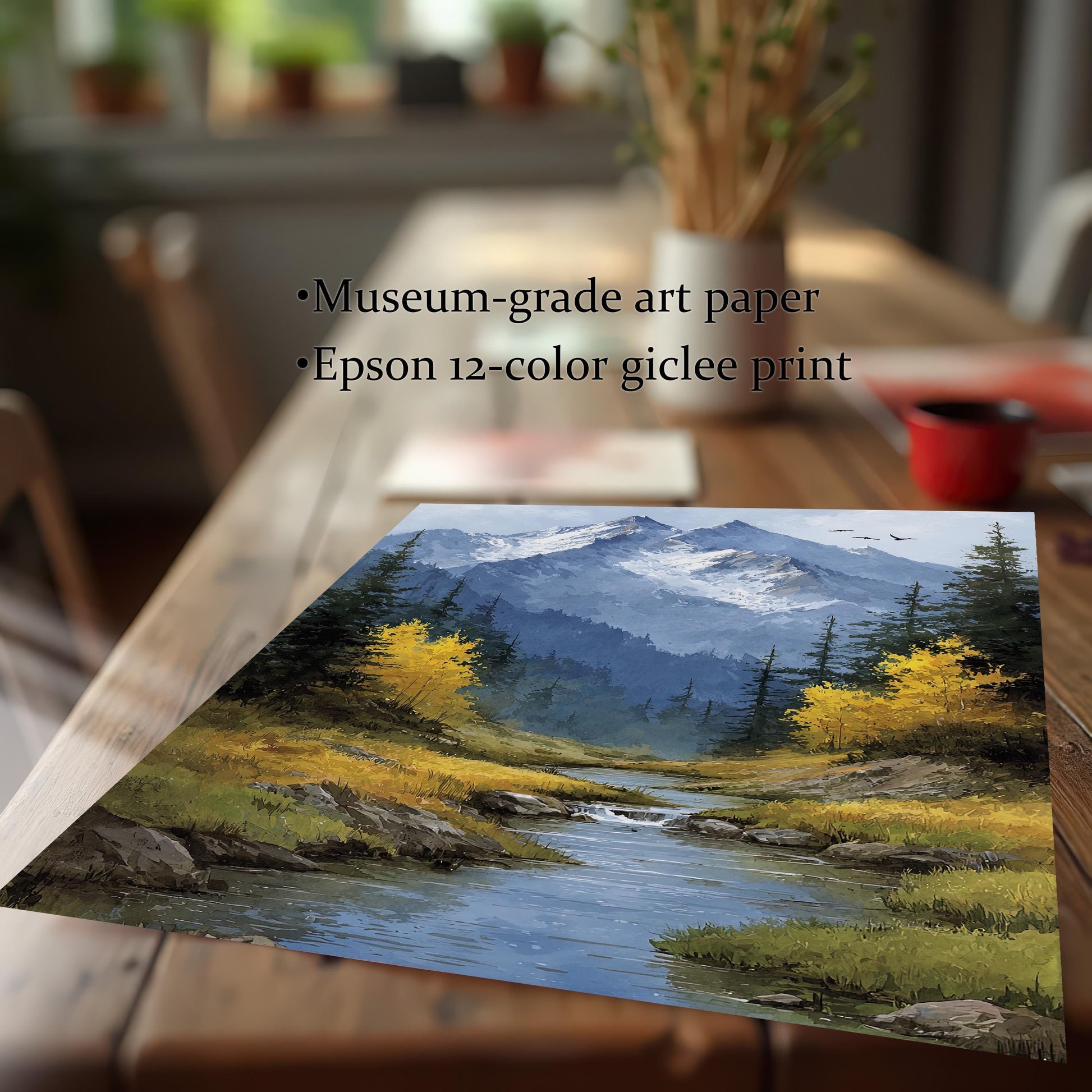 A close-up, angled view of a single art print of a mountain stream on a wooden table, highlighting its museum-grade paper and giclée printing.