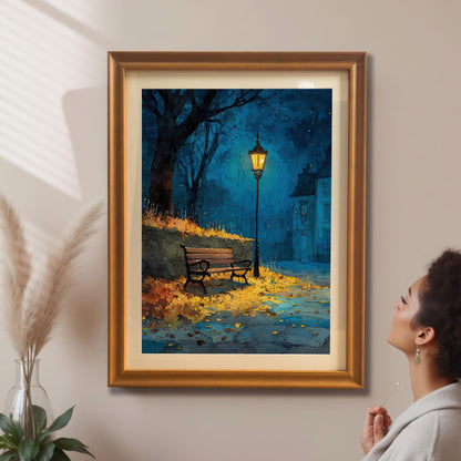 A framed painting of a street scene with a lamppost and a bench hanging on a beige wall. A person is visible on the right side of the image, looking up at the painting.