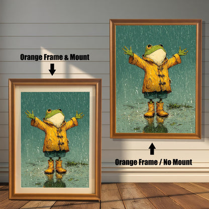 A side-by-side comparison of a cartoon-style frog painting. On the left, it's in a light brown, "orange" colored frame with a mount. On the right, it's in the same frame without a mount.