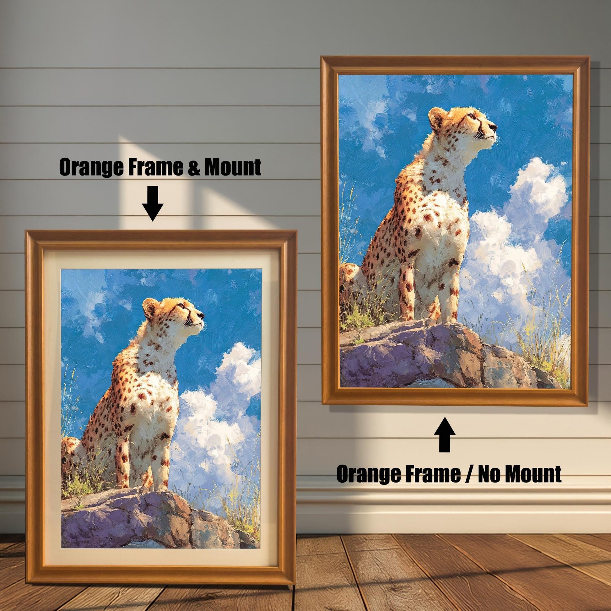 Two framed paintings of a cheetah sitting on a rock. The painting on the left is in an orange-brown frame with a mat. The one on the right is in an orange-brown frame without a mat. Text above each image indicates the difference in framing.