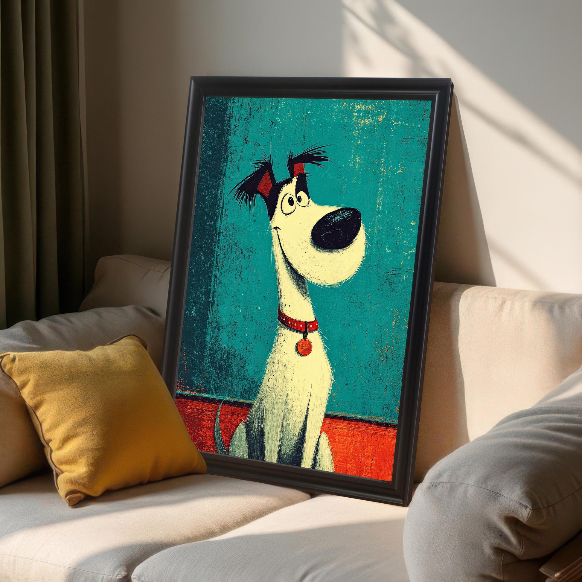 A black-framed cartoon dog art print leans against a couch, with a yellow pillow in the foreground.
