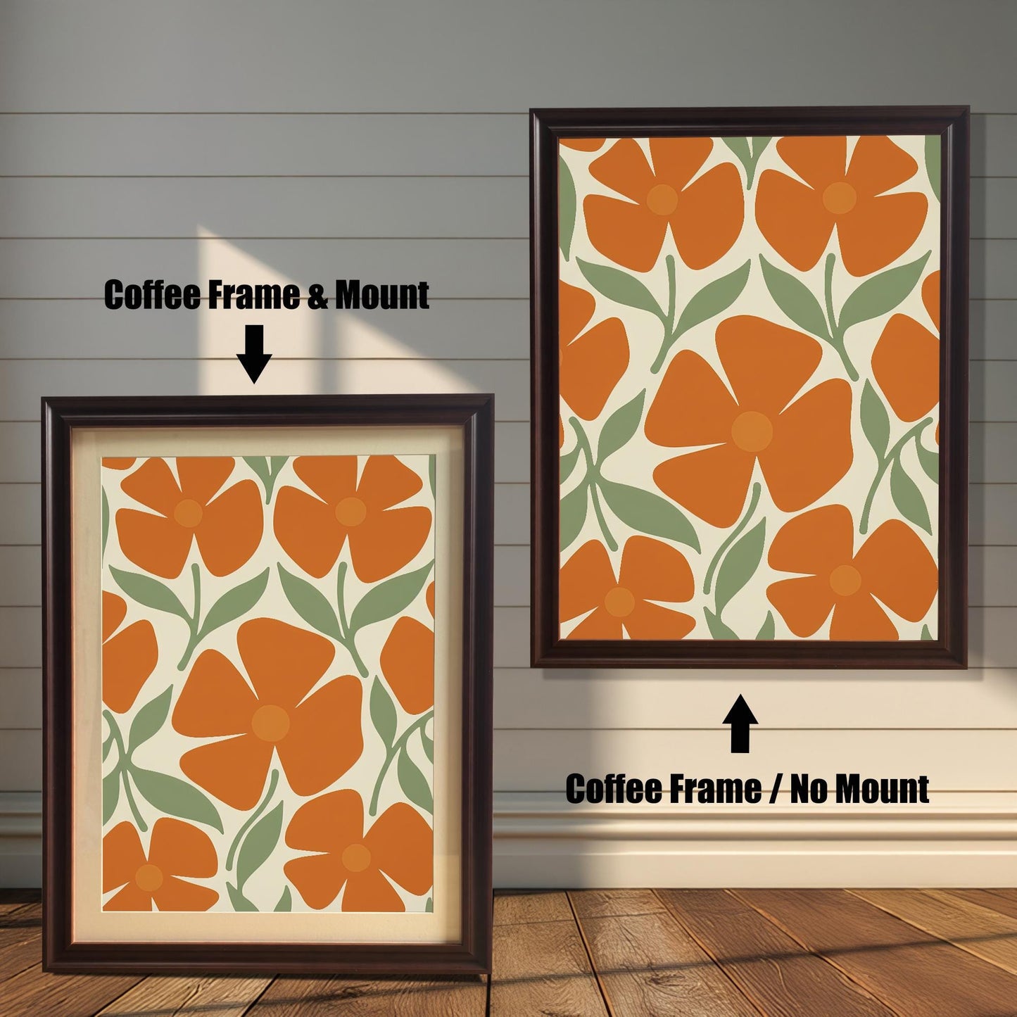 Two coffee-colored framed art prints with a repeating pattern of orange flowers and green leaves. One has a white mat board and the other does not.