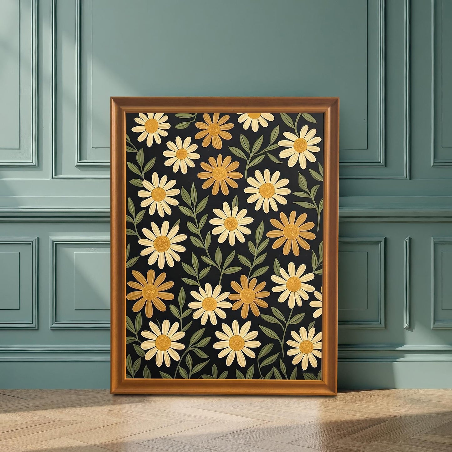 A framed art print of yellow flowers on a dark background, with a warm, natural wood frame, leaning against a teal wainscoting wall.