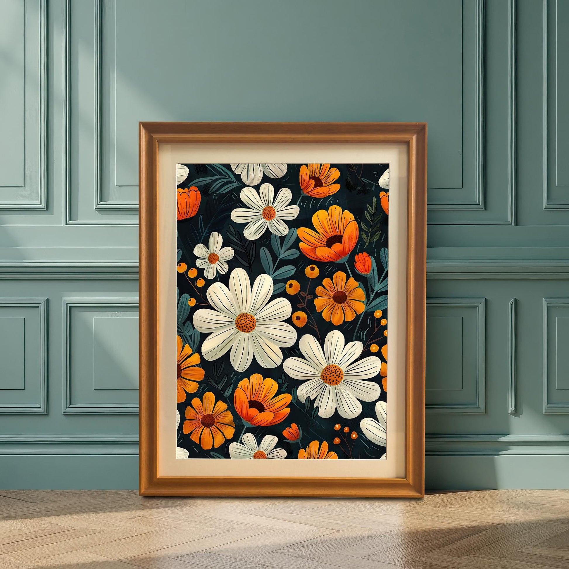 A framed floral print with an orange frame and a mount, leaning on the wooden floor against a paneled teal blue wall.