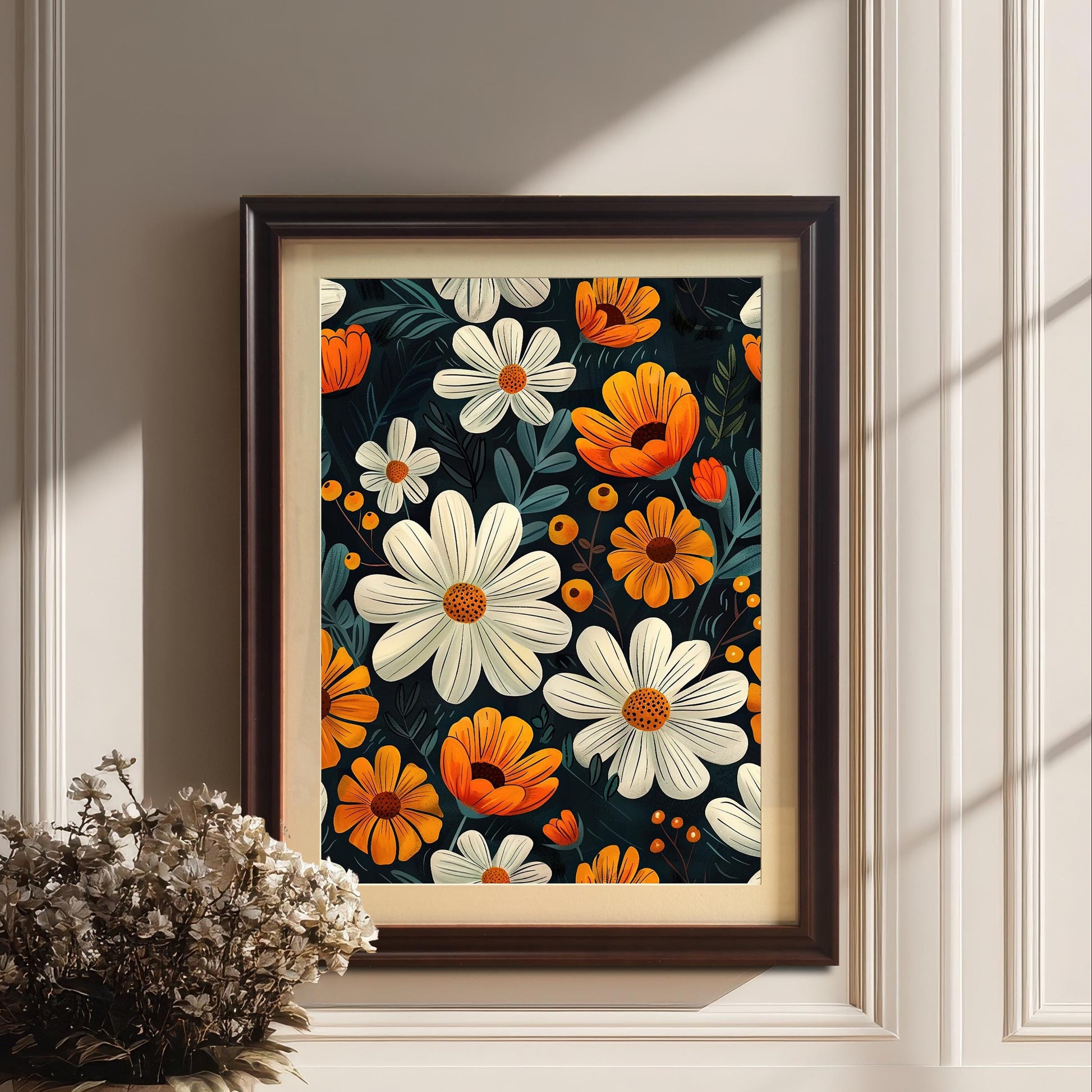 A white-framed art print of soft, stylized flowers hangs on a light gray paneled wall next to a large potted houseplant.